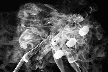 guitar in the smoke on black background