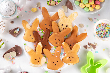 Food for Easter school lunchbox. Creative children's breakfast, pancakes in shape of Easter bunny...