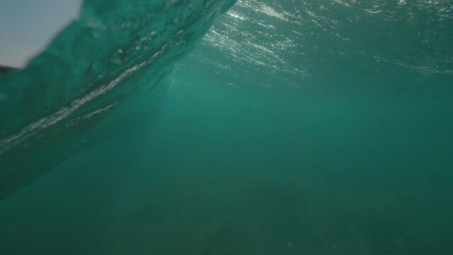 Ocean wave half half dome underwater shot in slow motion