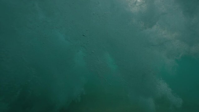 Ocean wave half half dome underwater shot in slow motion