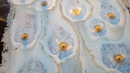 Aerial view of effluent discharge from a pulp and paper mill into a water body.