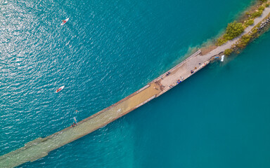 Aerial photo by drone of the Chanteloube bridge drowned in the turquoise waters of the...