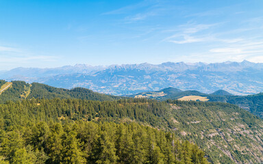 Obraz premium Aerial photography by drone of Mont Colombis in Serre-Ponçon, its mountains, located in the Hautes-Alpes in France