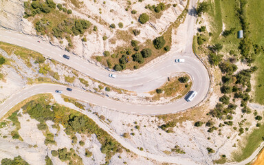 Aerial photography by drone of the rock formations, the Demoiselles Coiffées in Serre-Ponçon and its mountains, located in the Hautes-Alpes in France