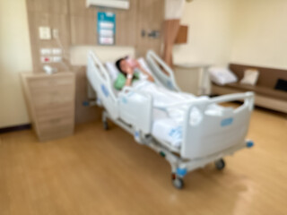 Blur image of Patients are recuperating in a luxurious, modern ward. The atmosphere is clear and...