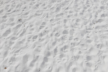 Fine white sand that glistens and reflects the sunlight.