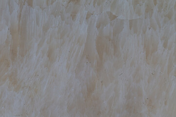 A close-up photo of the cream-colored stone, showing the details of the stone