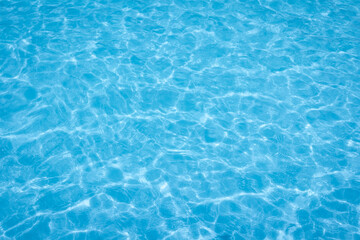 The light reflects blue in the water in the swimming pool. It looks fresh and lively, suitable for use as a wallpaper.