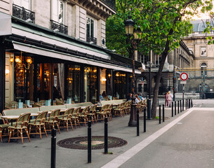 Cozy street with tables of cafe in Paris, France. Cityscape of Paris. Architecture and landmarks of Paris. - 745816865