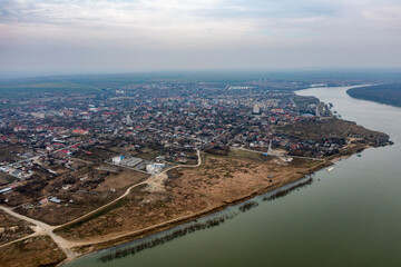 Obraz premium Riverside Urban Charm: Aerial View of Danube City Shoreline In Romania