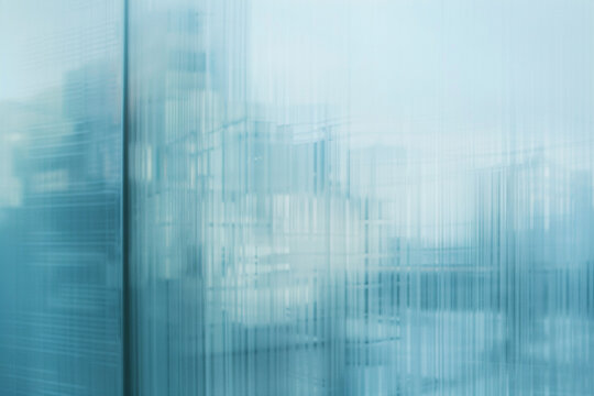 minimalist shot featuring the abstract patterns and reflections on the glass wall of a modern business office building, with a soft blue hue enveloping the scene and blurring the s