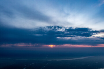 Fototapeta na wymiar Dusk's Embrace: Aerial Capture of Danube River at Sunset in Romania