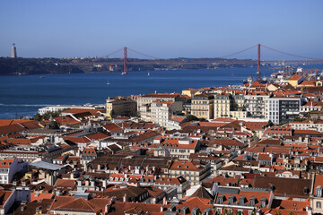 aerial view of downtown lisbon with the ponte do 25 abril suspension bridge in background