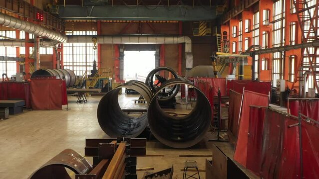 welding pipes in shop at factory