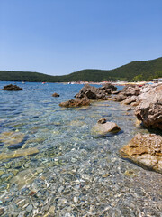 seascape with clear turquoise water among rocks and stones. holidays, summer vacation