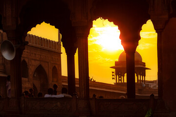 intensive beautiful sunset seem at the arcades of the red Fort in New Delhi,