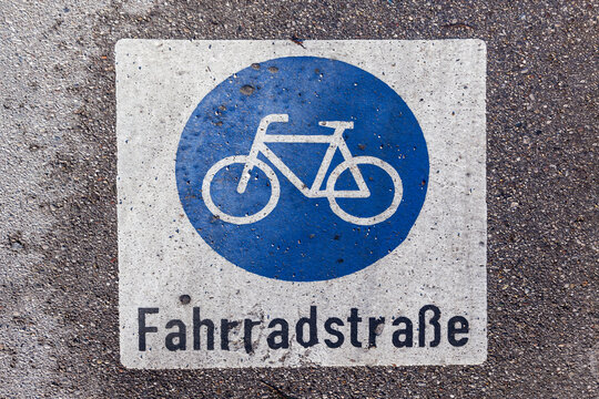 sign bicycle lane painted at the street