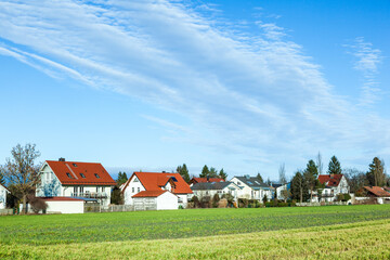 Fototapeta na wymiar new houses in Munich Allach in agricultural area for families