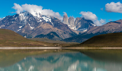 Torres del Paine peaks reflection in bitter lagoon (Laguna Amarga), Torres del Paine national park, Patagonia, Chile. - obrazy, fototapety, plakaty
