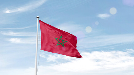 Morocco national flag cloth fabric waving on the sky.