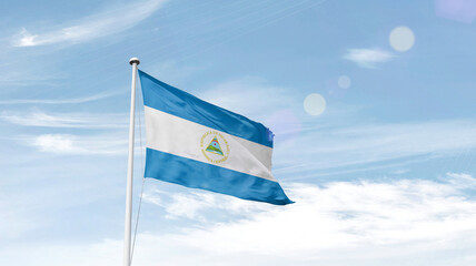 Nicaragua national flag cloth fabric waving on the sky.