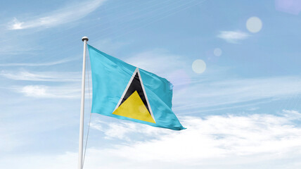 Saint Lucia national flag cloth fabric waving on the sky.