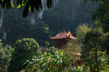 Temple roof of of Buddhist Đầm sen Bích Động with Mountain Background © Chris