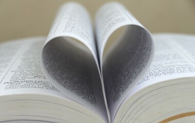 Open book with open pages shape of heart