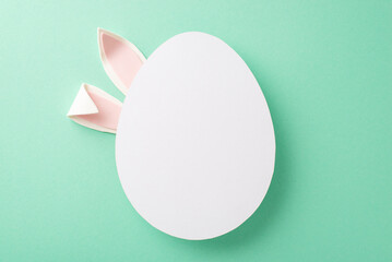 Easter artistry idea: top view photo of endearing bunny ears obscured by an open egg-shaped frame...