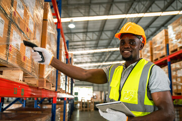 Picture of young man stock check and barcode scan in the warehouse. Holding a digital tablet in his...
