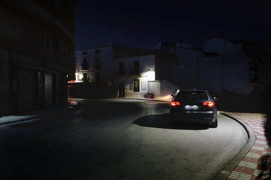 A car on the street at night in the city of Quesada in the province of Jaen. Transportation. Travel and tourism concept