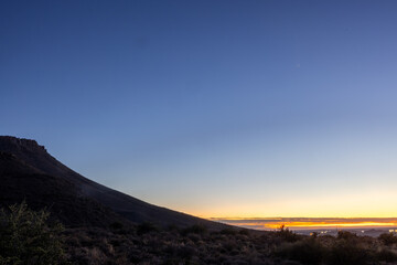 Blue hour Sunrise sky over the Karoo National Park with Beaufort West in the background, Karoo, Western Cape, South Africa