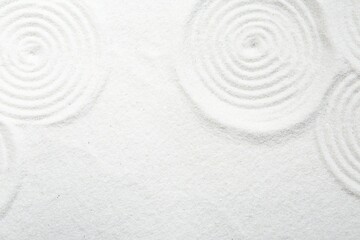 Obraz na płótnie Canvas Zen rock garden. Circle patterns on white sand, top view