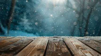 Gardinen Sunlight filtering through a snowy forest onto a rustic wooden tabletop, evoking a cozy winter feel. © tashechka