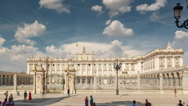MADRID, SPAIN - FEBRUARY 19, 2024: Timelapse hyperlapse picturesque view of the Royal Palace of Madrid. Famous touristic landmark in the old historical city center.