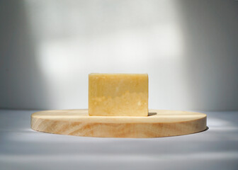 Natural Handmade Soap Bar on Wooden Tray with Minimalist Background