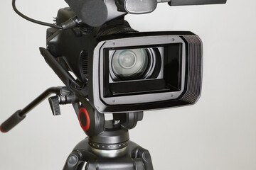 Video camera on a white background with a wide lens