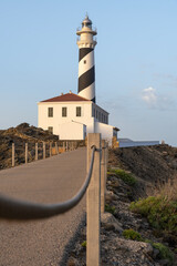 Long path until you reach the Favaritx lighthouse in Menorca in the Balearic Islands. Tourism concept