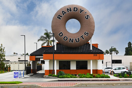 COSTA MESA, CALIFORNIA - 25 FEB 2024: Randys Donuts on Harbor Boulevard, with is iconic giant doughnut atop the building.