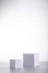 White square podiums in sunlight with shadow on white background. Trend fashion showcase