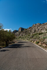 Idyllic landscape of a mountain road on a sunny day, Alicante, Costa Blanca, Spain - stock photo