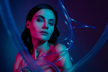 Photo of woman with plastic beauty cables look isolated on neon modern colorful background