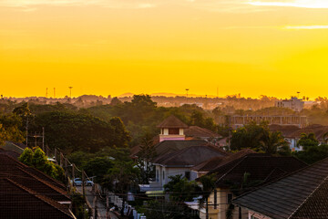 Beautiful golden colorful sunrise over the city panorama Pattaya Thailand.