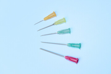syringe for injectable medication on blue background