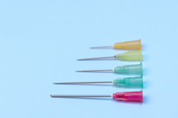 syringe for injectable medication on blue background