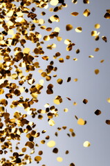 Golden Confetti Celebration on Light Background