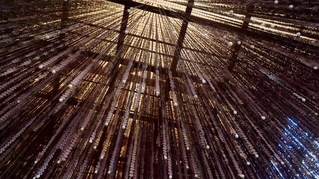 4k, A bottom-up view of the numerous garland necklaces, monisto dangling from the ceiling of the Bab Al Bahrain Bazaar, at daytime, Manama, Bahrain