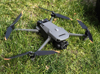 Detailed of a high-tech drone with large sensors and multifunctional camera, with powerful zoom and thermal, for rescue and surveillance, horizontal in the grass