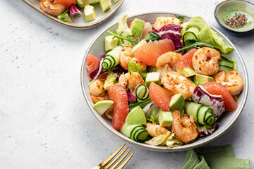 Healthy salad with shrimp prawns, grapefruit, avocado, cucumber and green salad