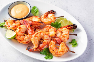 Grilled shrimps. Shrimps skewers, lime and fresh herbs